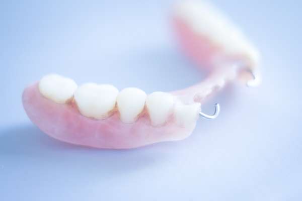 Should I Get Dentures or Dental Implants from Family Choice Dental in Albuquerque, NM